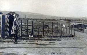 A sentry guards the entrance to Cassel POW Camp (CC BY-SA 3.0 via Wikimedia Commons)