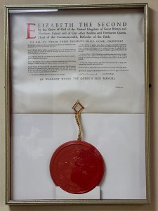 Framed document with red wax seal attached